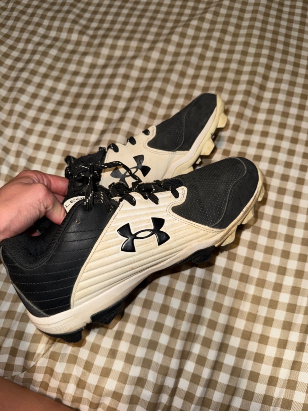 Under Armour Black and Cream Athletic Cleats